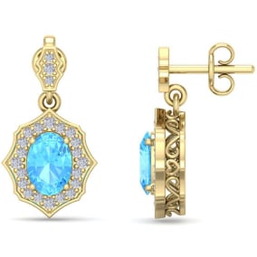 Retrograde Birthstones™ 2 1/4 Carat Oval Shape Blue Topaz and Diamond Dangle Earrings In 14 Karat Yellow Gold