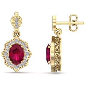 2 1/5 Carat Oval Shape Ruby and Diamond Dangle Earrings In 14 Karat Yellow Gold