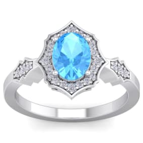 Retrograde Birthstones™ 1 3/4 Carat Oval Shape Blue Topaz and Diamond Ring In 14 Karat White Gold
