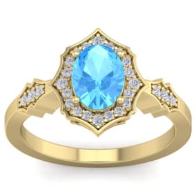 1 3/4 Carat Oval Shape Blue Topaz and Diamond Ring In 14 Karat Yellow Gold