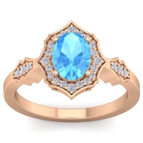 1 3/4 Carat Oval Shape Blue Topaz and Diamond Ring In 14 Karat Rose Gold