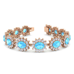 24 Carat Oval Shape Blue Topaz and Halo Diamond Bracelet In 14 Karat Rose Gold, 7 Inches