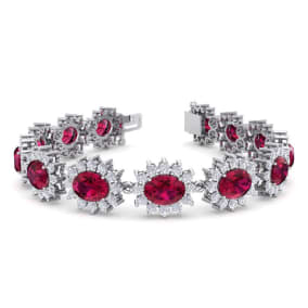 Retrograde Birthstones™ 25 Carat Oval Shape Ruby and Halo Diamond Bracelet In 14 Karat White Gold, 7 Inches