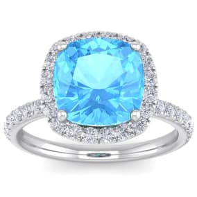 Blue Topaz Ring: 5 1/2 Carat Cushion Cut Blue Topaz and Halo Diamond Ring In Sterling Silver