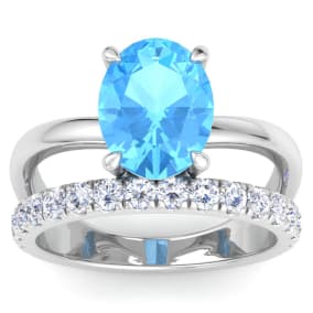 3 3/4 Carat Oval Shape Blue Topaz and Halo Diamond Ring Plus Band In 14 Karat White Gold