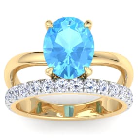 3 3/4 Carat Oval Shape Blue Topaz and Halo Diamond Ring Plus Band In 14 Karat Yellow Gold