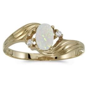 Opal Jewelry: 1/4ct Oval Opal And .02ct Diamond Ring in 10k Yellow Gold
