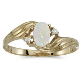 1/4ct Oval Opal And .02ct Diamond Ring in 10k Yellow Gold